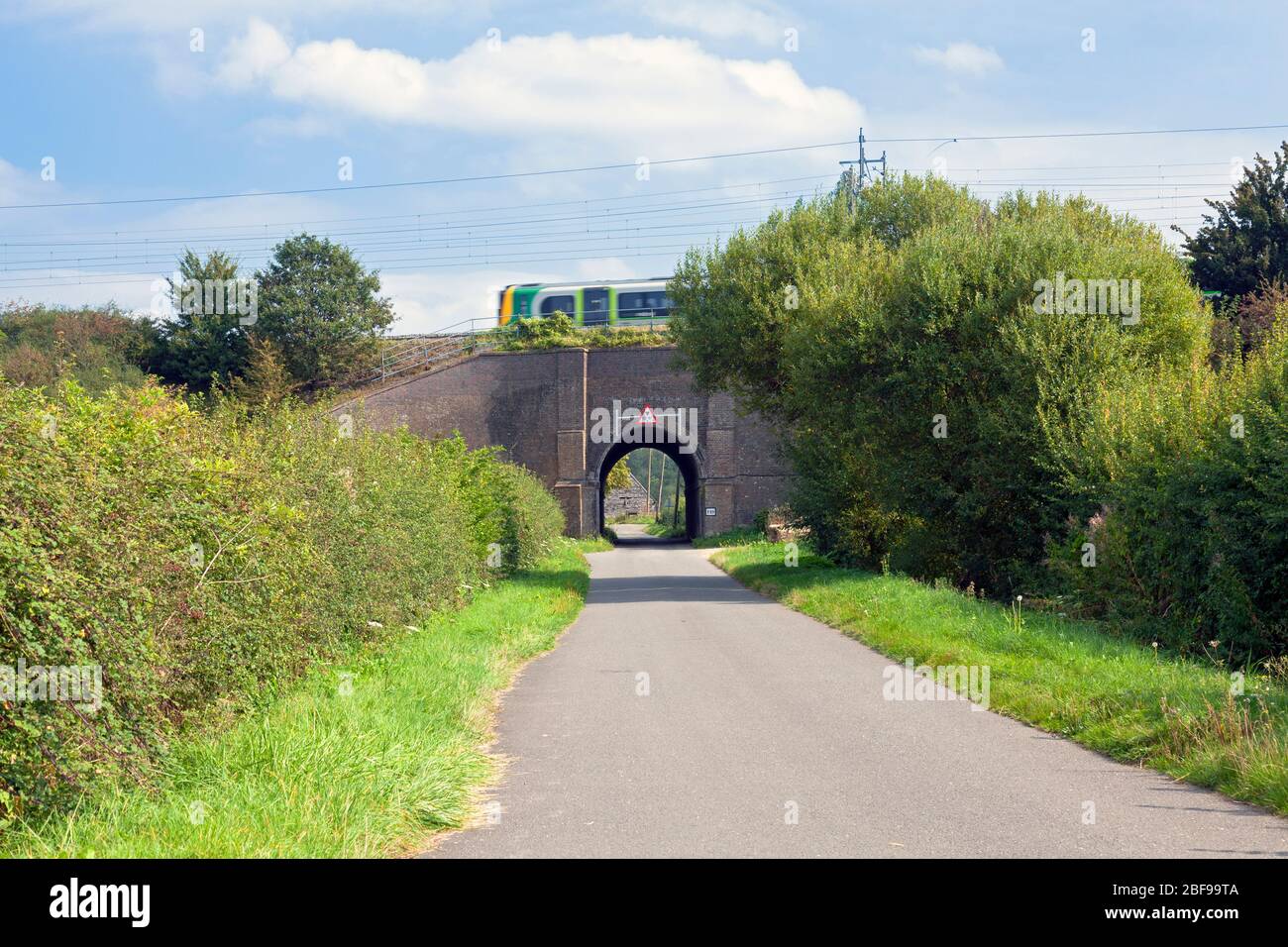 England, Buckinghamshire, Cheddington, Railway bridge below West Coast Mainline near Pitstone Wharf Stock Photo