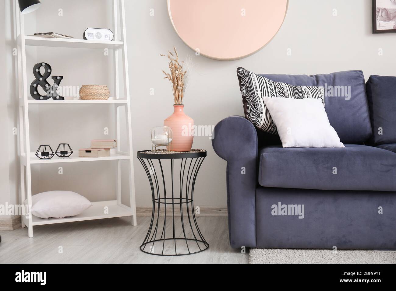 Interior of modern room with comfortable sofa and table Stock Photo - Alamy