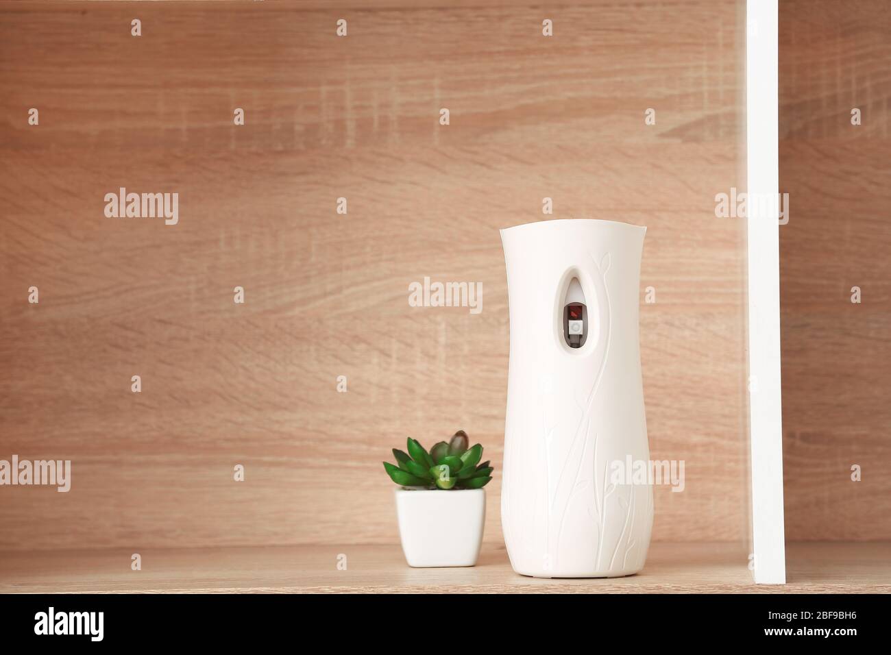 Modern air freshener on shelf Stock Photo - Alamy