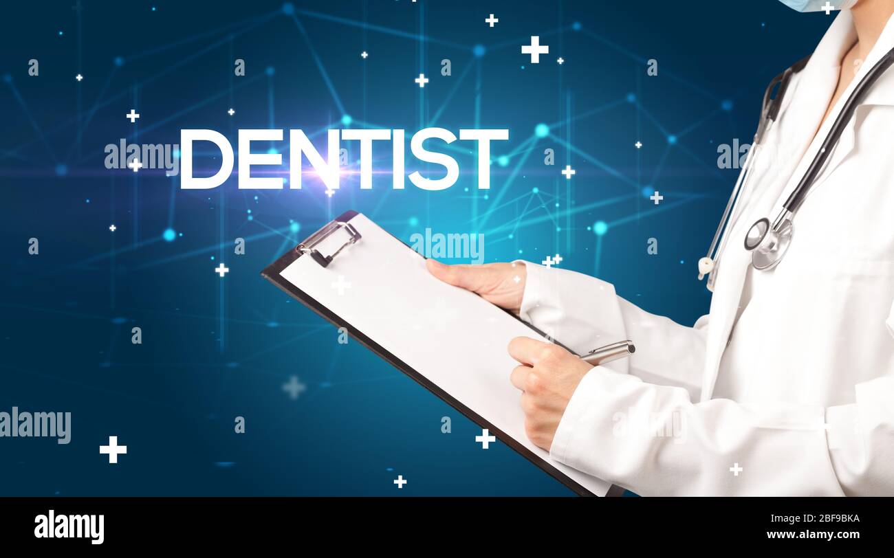 Doctor fills out medical record with DENTIST inscription, medical concept Stock Photo Alamy