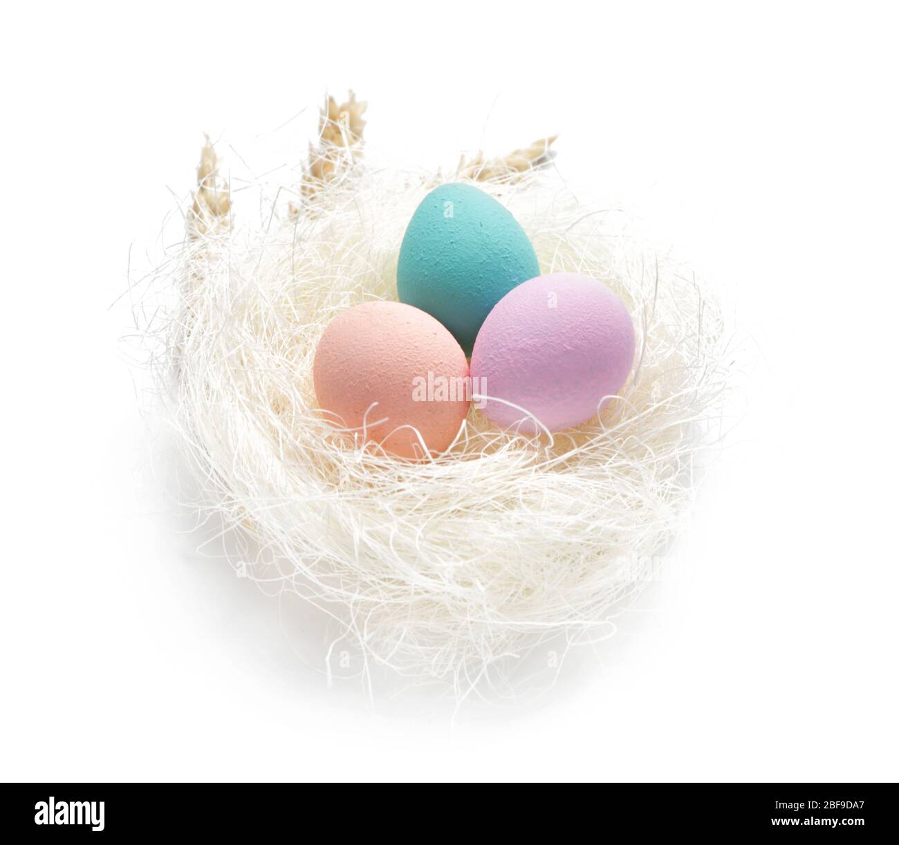Nest with beautiful Easter eggs on white background Stock Photo - Alamy