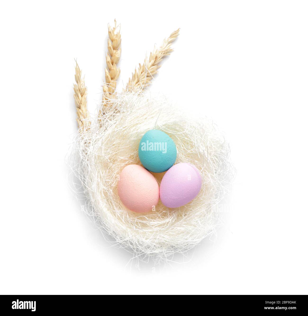 Nest with beautiful Easter eggs on white background Stock Photo - Alamy