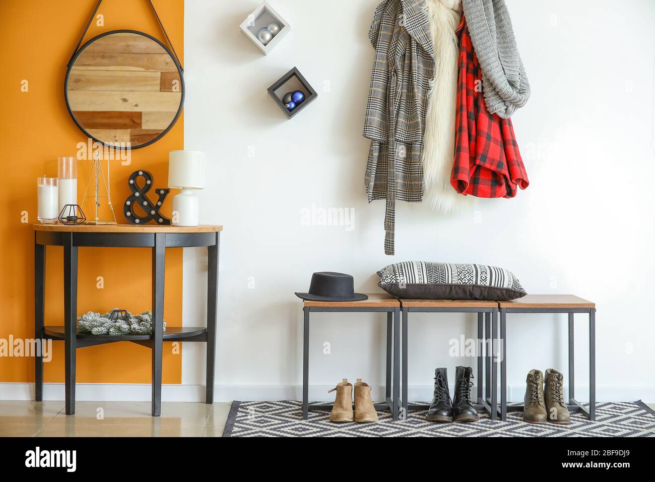Stylish interior of modern hall with winter clothes Stock Photo - Alamy