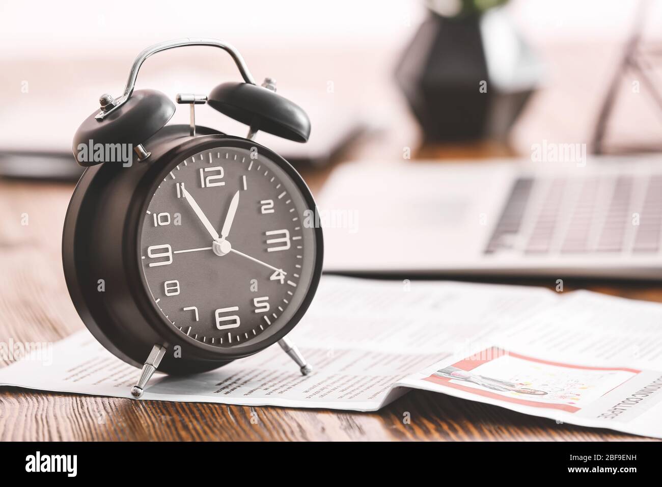 Alarm clock on office table. Time management concept Stock Photo - Alamy