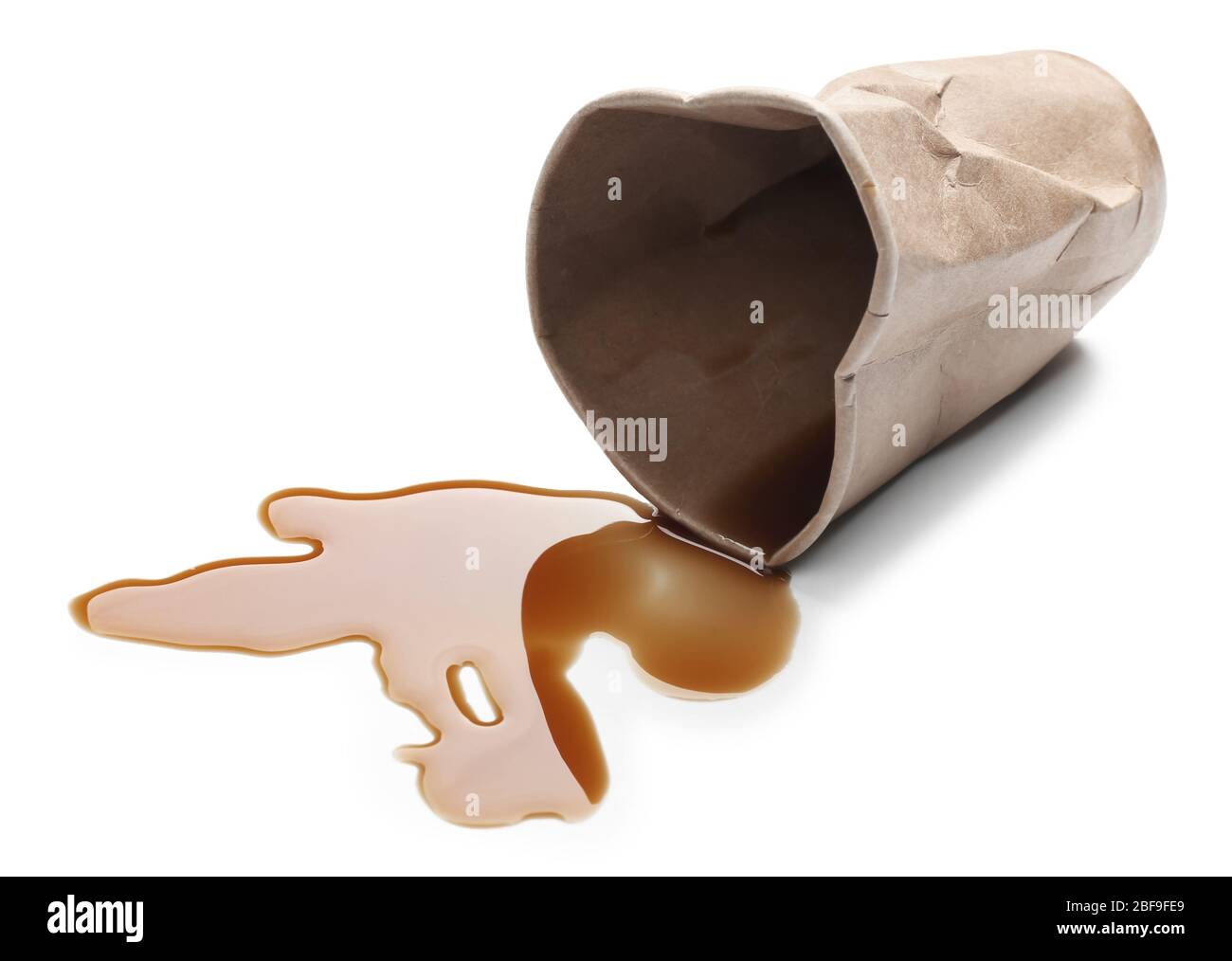 Overturned paper cup and spilled coffee on white background Stock Photo ...