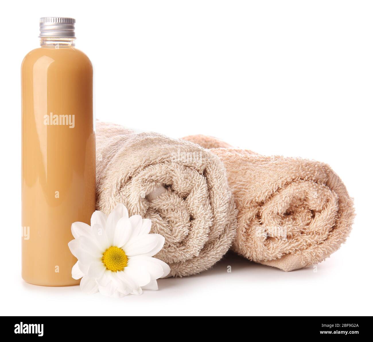Shampoo and towels on white background Stock Photo