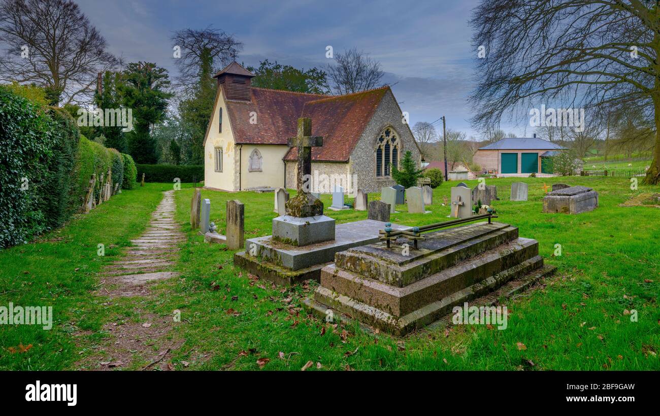 Bramdean, UK - April 7, 2020:  The Church of St Simon and St Jude next to Bramdean Manor in Hampshire, UK Stock Photo