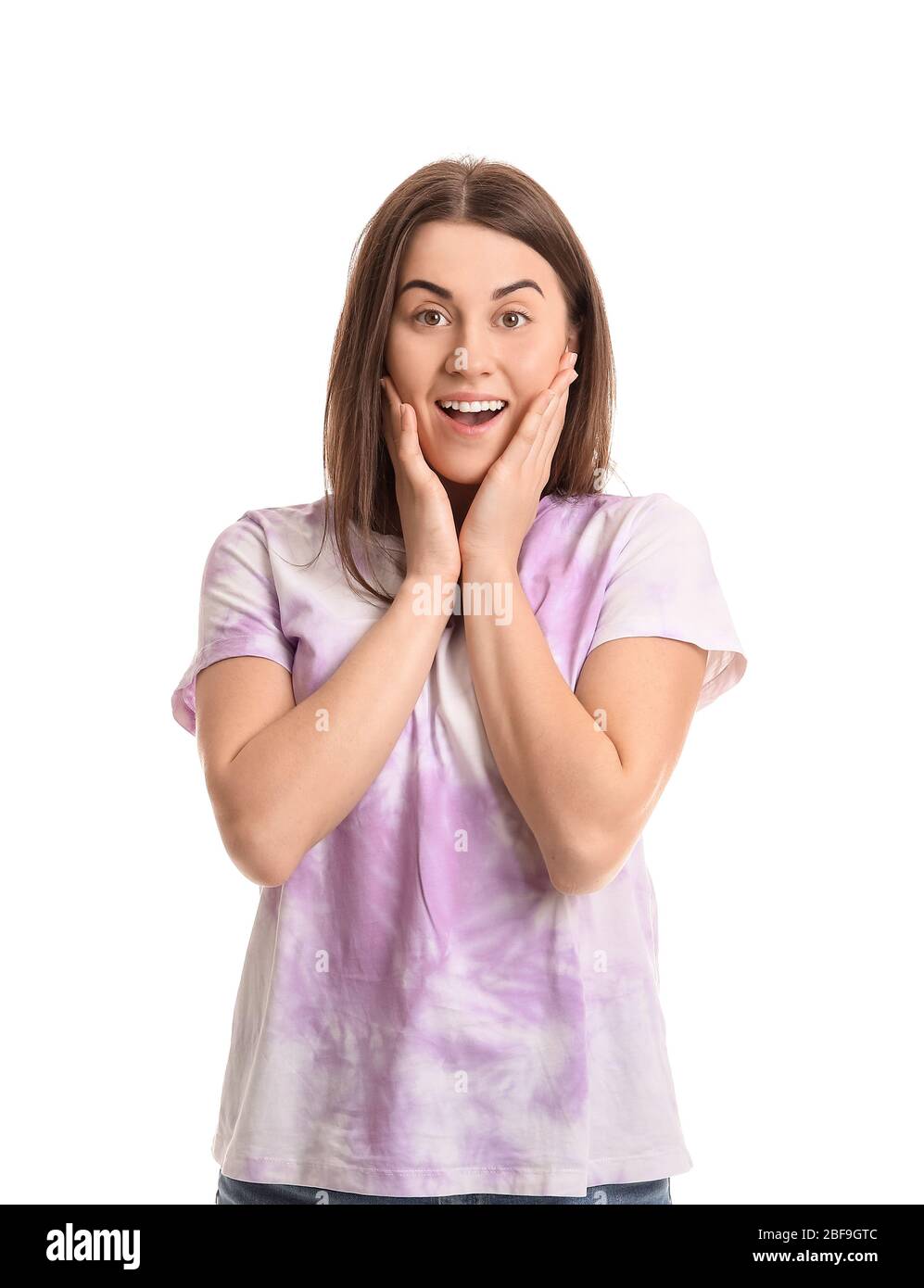 Surprised young woman on white background Stock Photo - Alamy