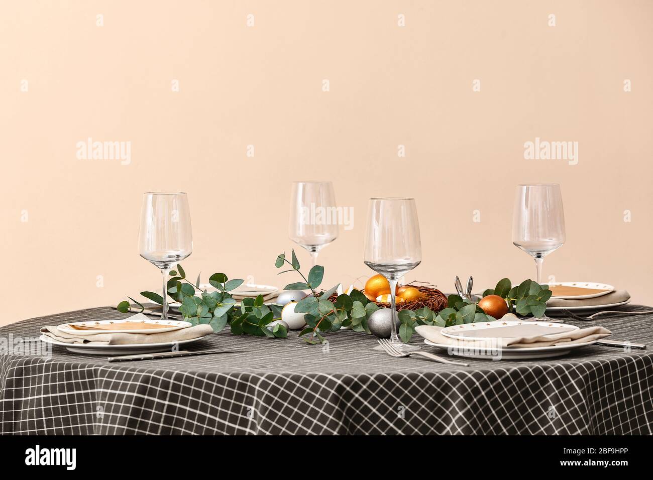 Beautiful table setting for Easter celebration Stock Photo