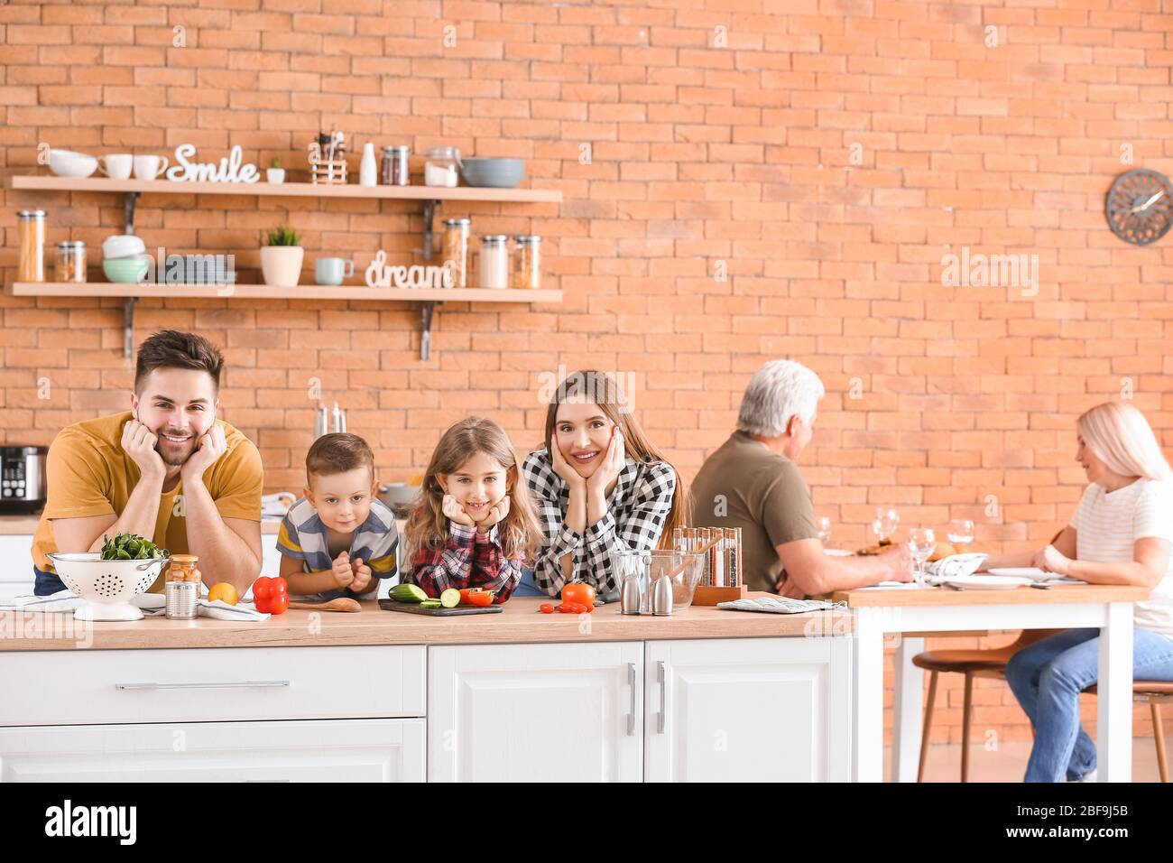 Big family spending time together in kitchen Stock Photo