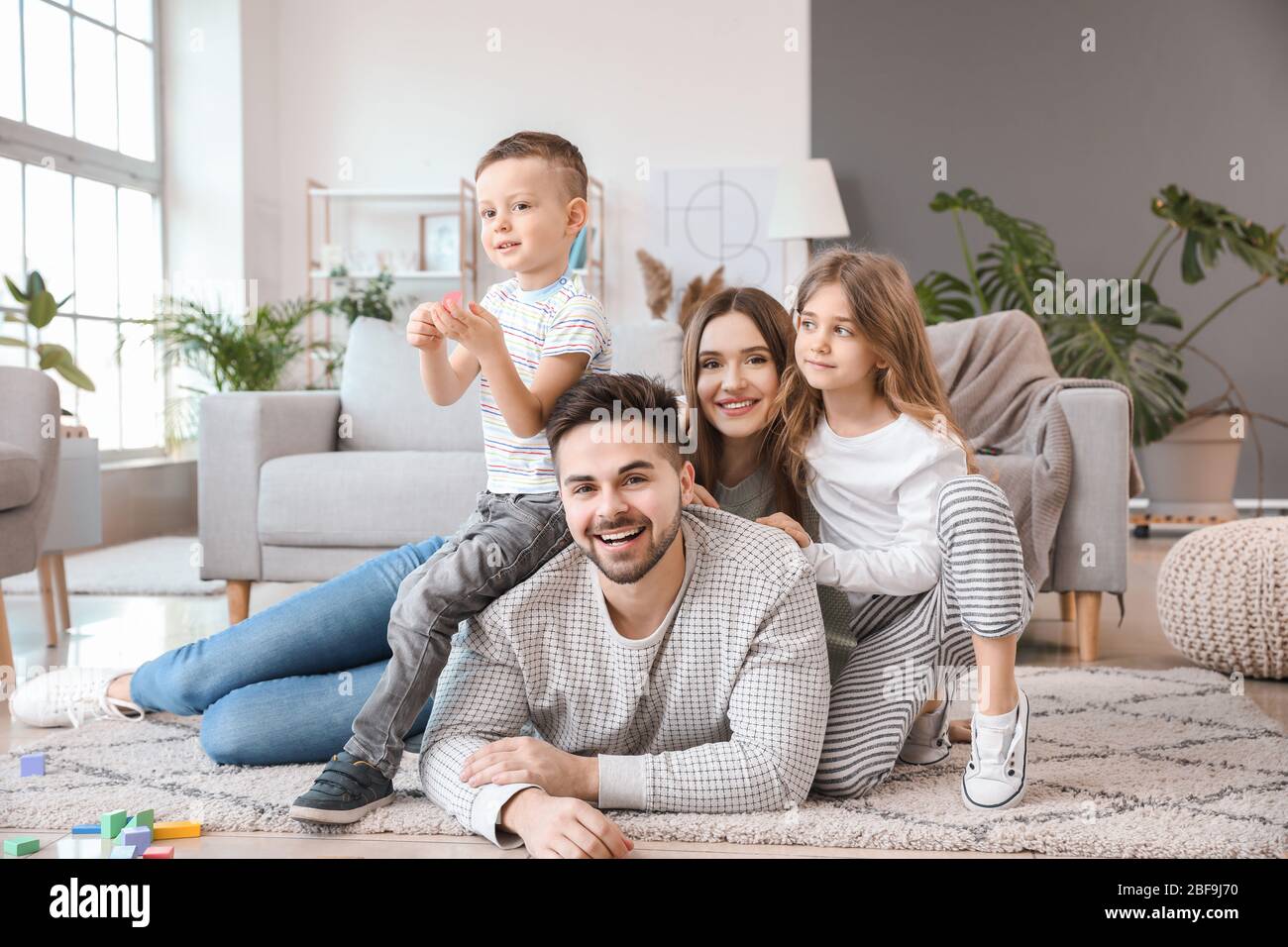 Happy family spending time together at home Stock Photo