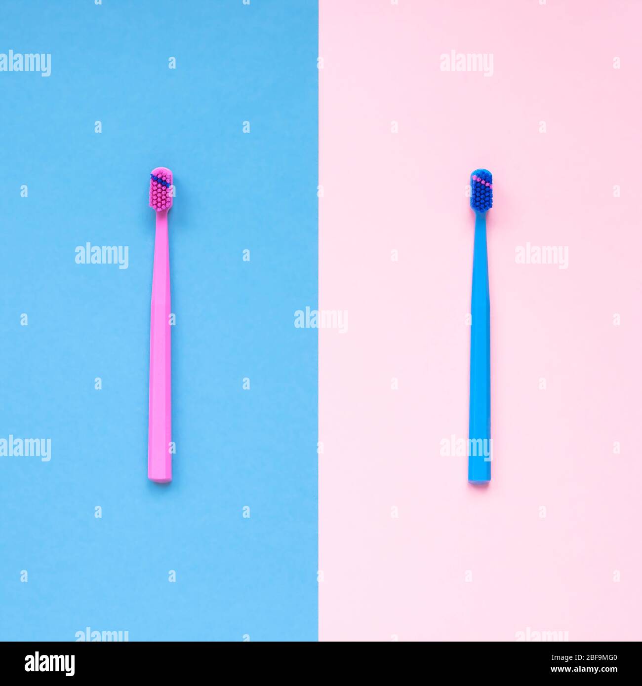 Teeth hygiene and oral dental care products on color pink and blue ...