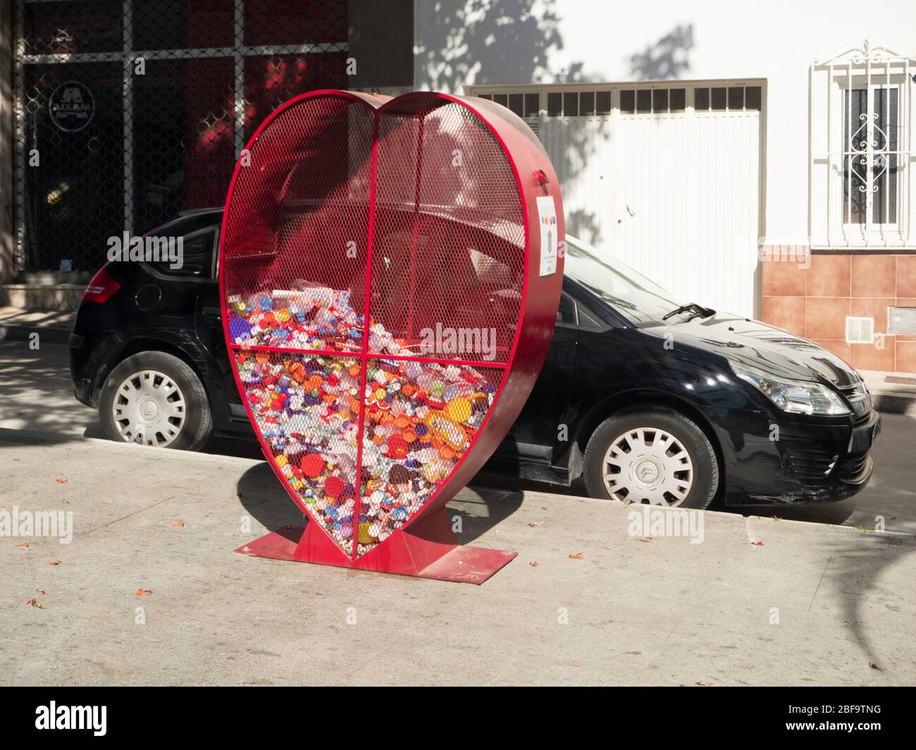 Heart shaped plastics recycling bin Stock Photo