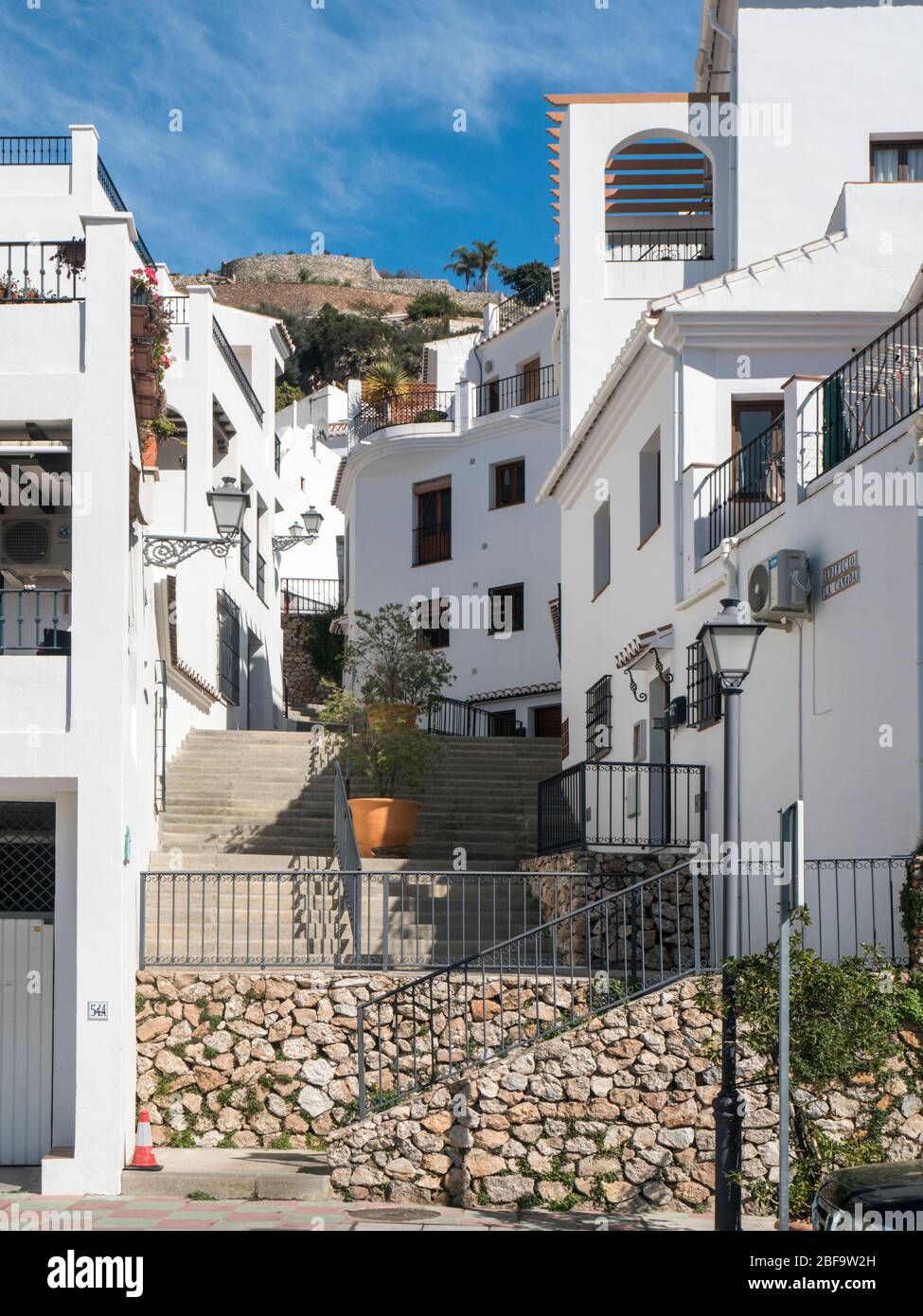 Street scene in Frigiliana, Andalusia, Spain, built on a hillside with white buildings. Stock Photo