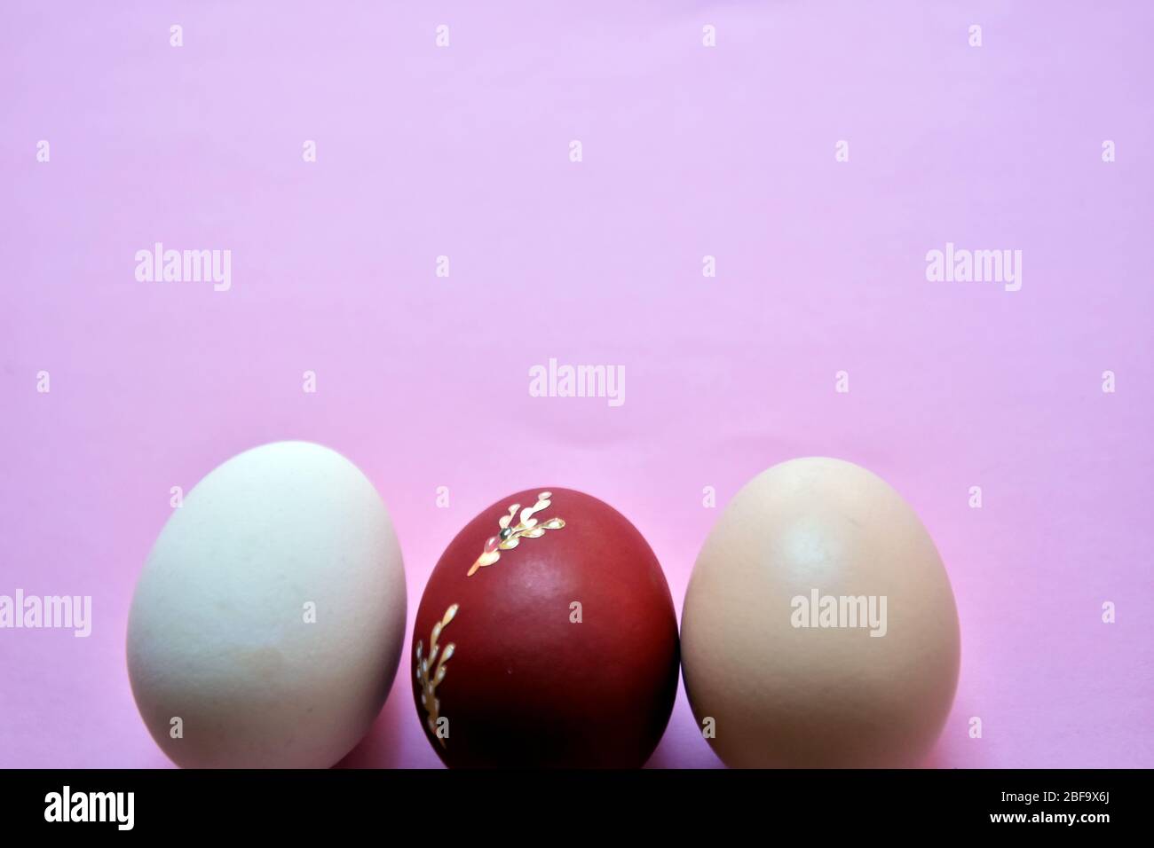 Easter eggs on pink background. Easter background. Stock Photo