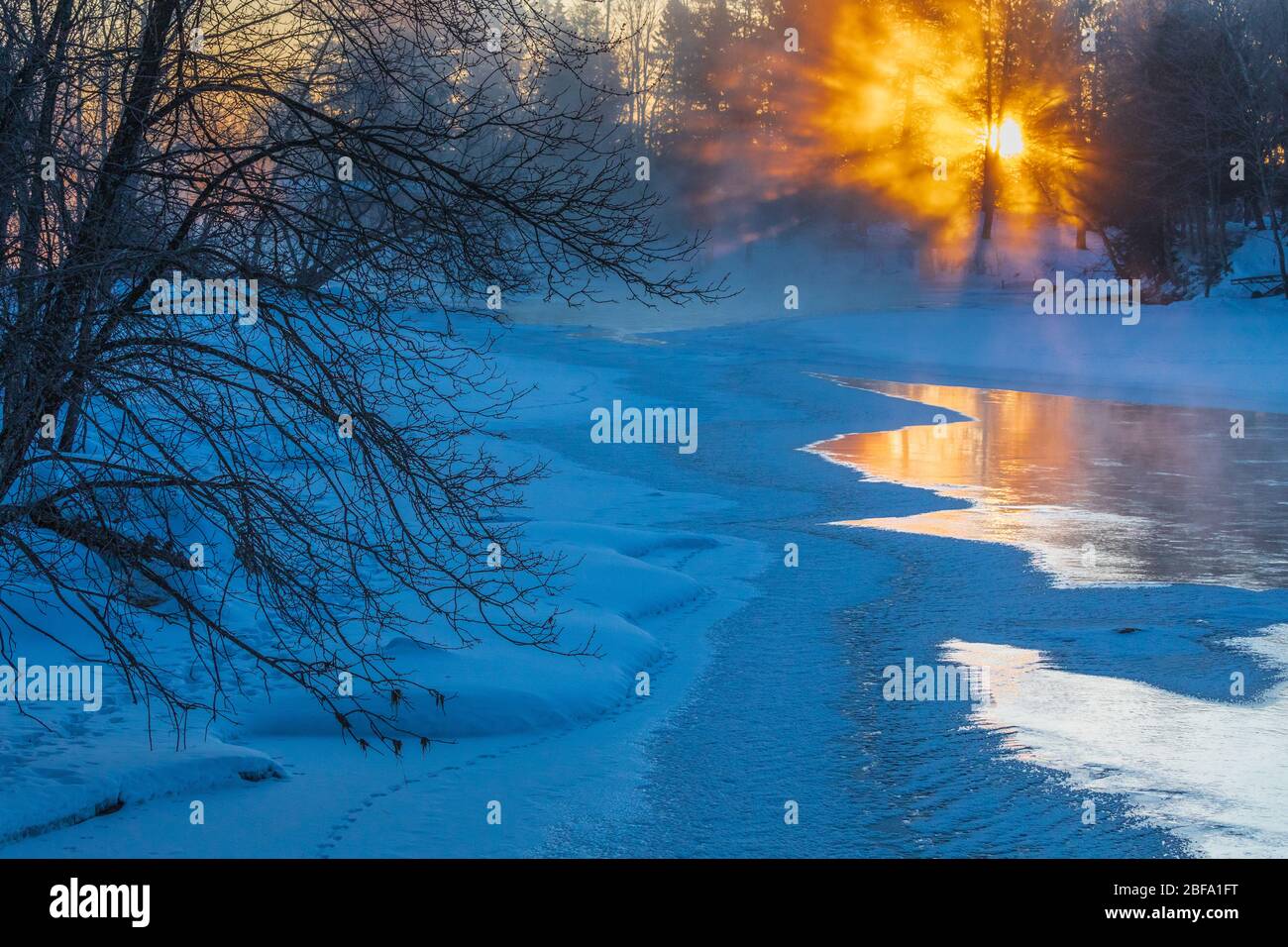 Sunrise on a frigid morning on the east fork of the Chippewa River. Stock Photo