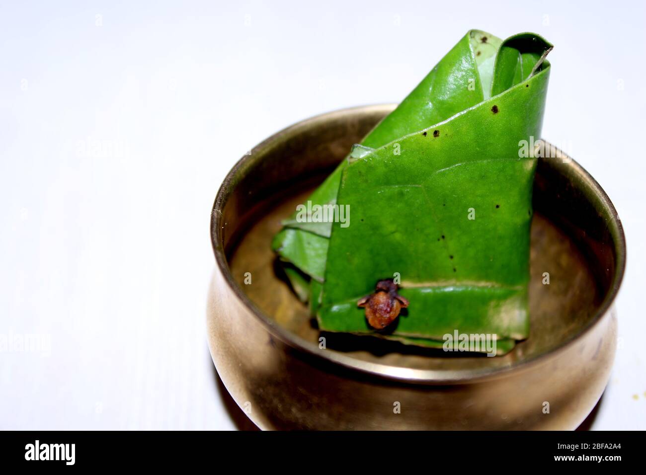 sweet paan high resolution stock photography and images alamy https www alamy com indian mouth freshener sweet paan betel nut leaf served in vintage brass bowl with indian traditional pattern image353648572 html
