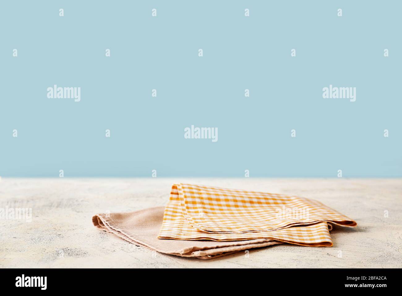 Napkin on table against color background Stock Photo