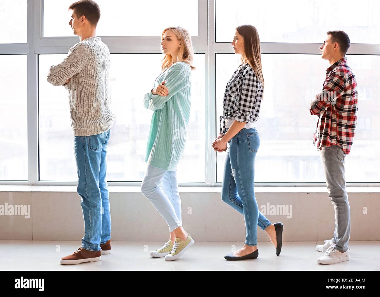 To Stand In Line People standing waiting in line for job interview hi-res stock ...