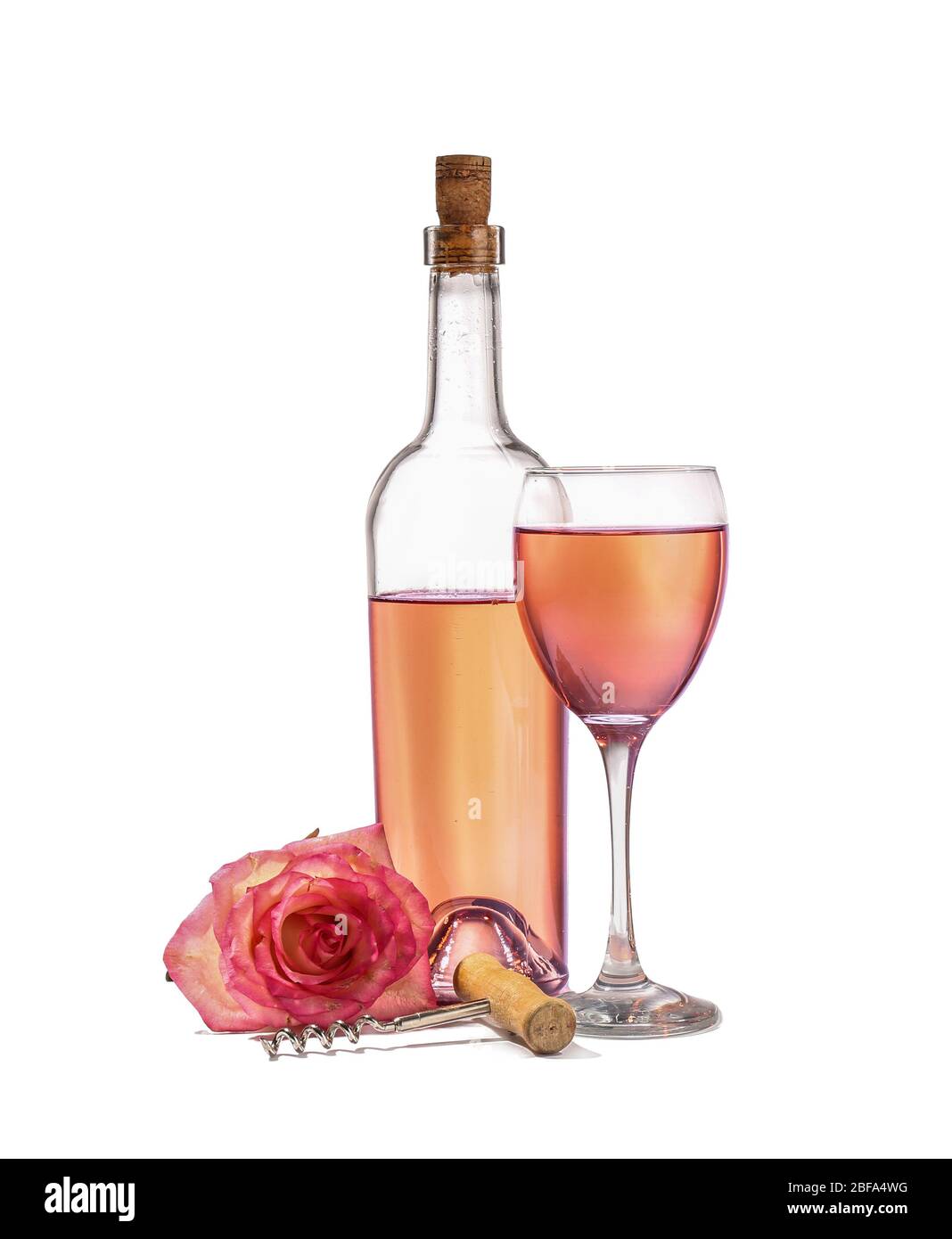 Glass and bottle of wine with rose flower on white background Stock