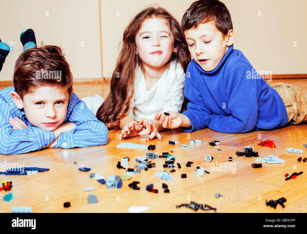 funny cute children playing toys at home, boys and girl smiling, first ...