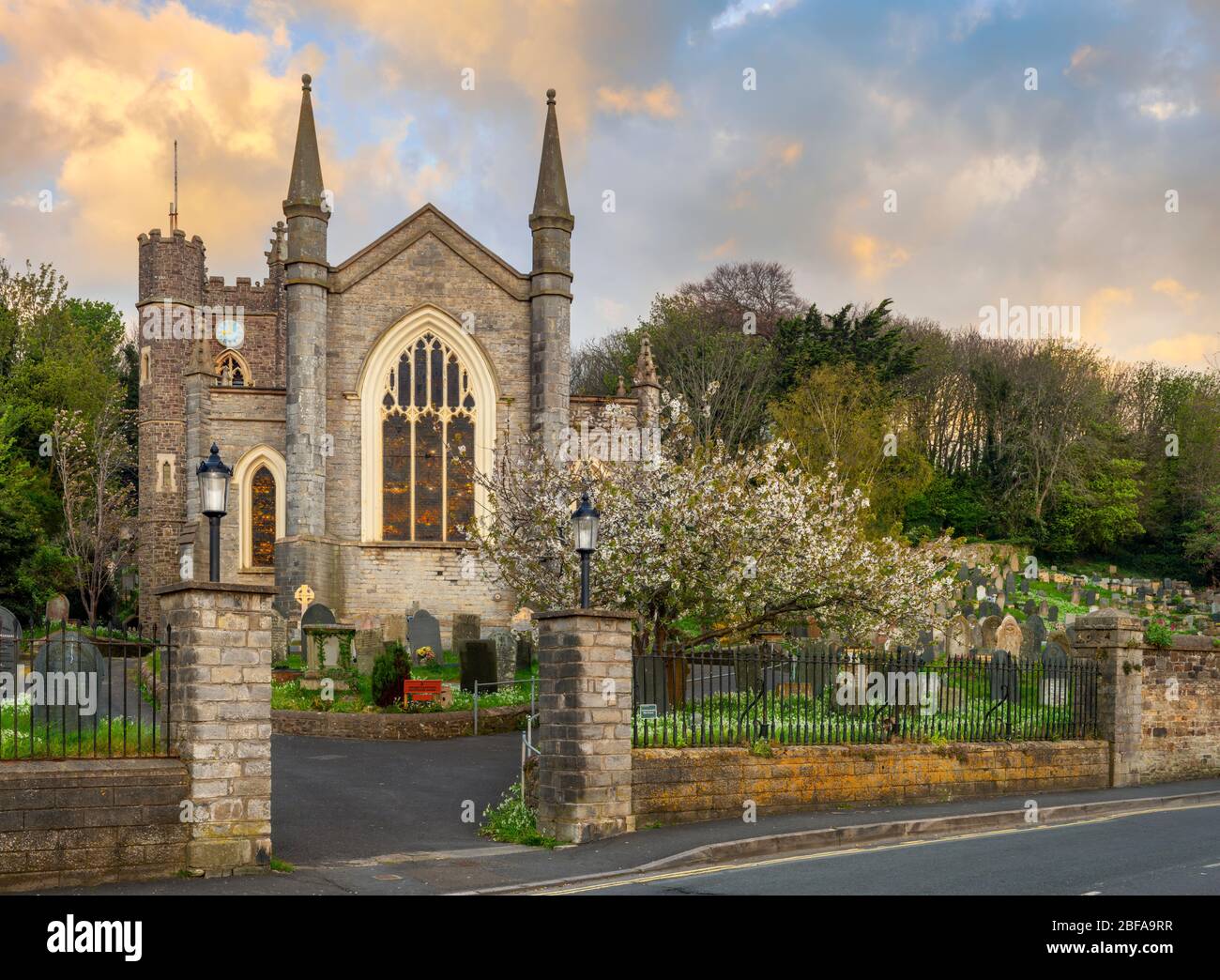 St Mary's Church windows reflecting the sunrise on a beautiful spring morning in North Devon. Stock Photo