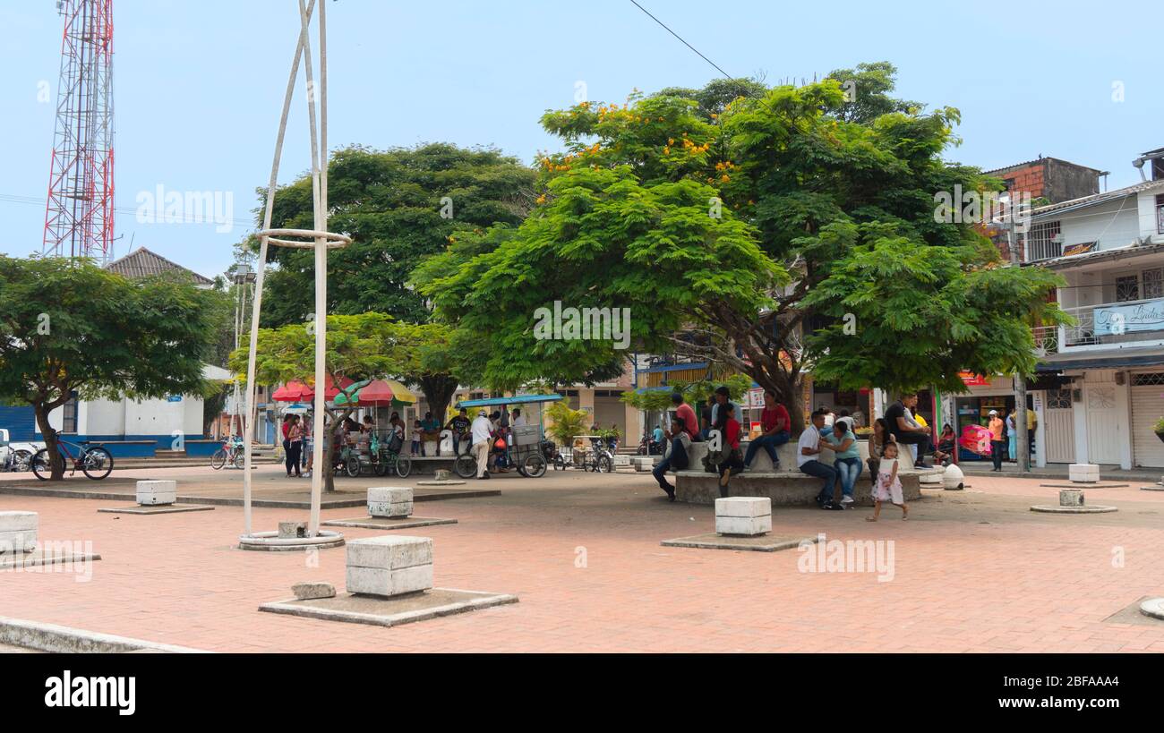 La Hormiga, Putumayo / Colombia - March 8 2020: People walking through Los Fundadores park in the city center on a sunny day Stock Photo