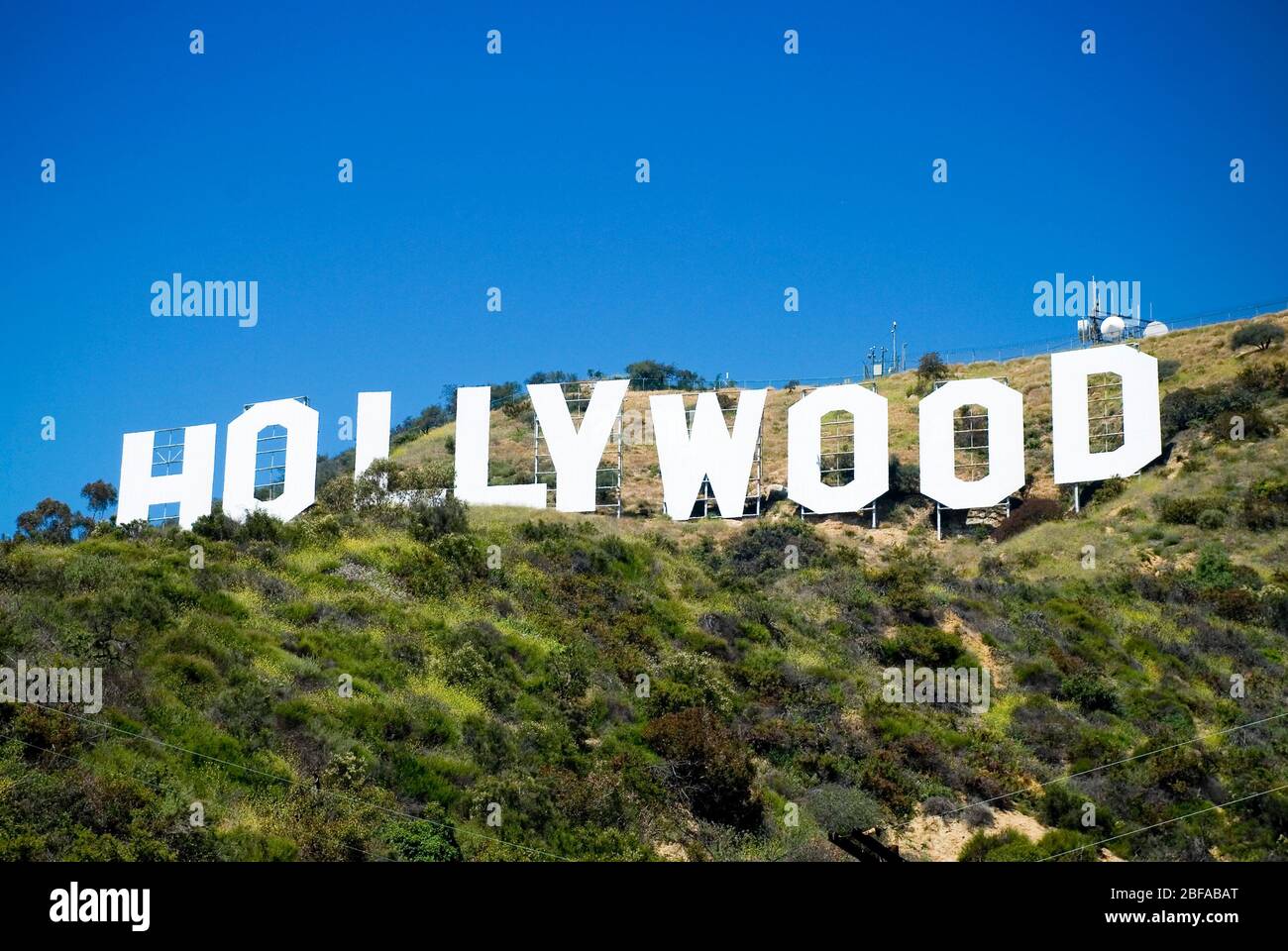 Iconic Hollywood sign in Hollywood Hills, Los Angeles, California. Blue sky, centred, landscape format, copy space. Stock Photo