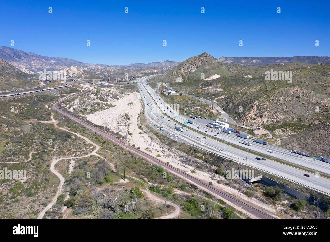 Aerial view of Interstate 15 (I-15) freeway as it climbs the grade at the Cajon Pass connecting Los Angeles with the desert and Las Vegas Stock Photo