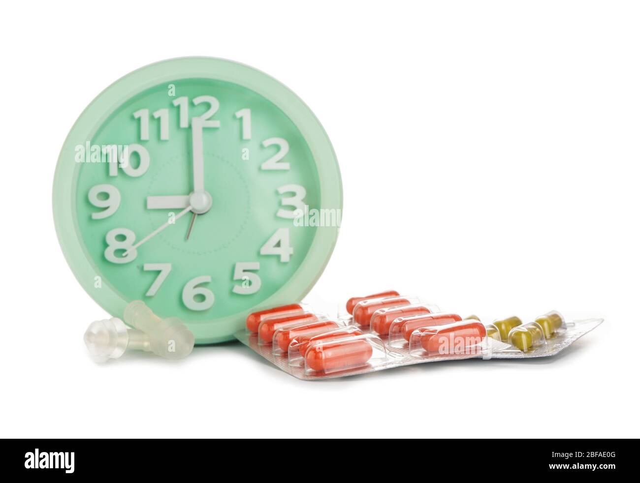 Alarm clock and sleeping pills on white background Stock Photo Alamy