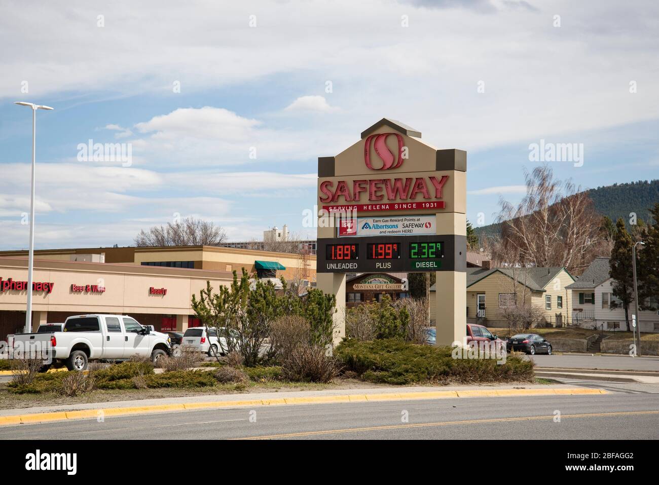 Helena, Montana - April 10, 2020: Safeway grocery store outdoor sign with low gas prices during Coronavirus Covid-19 shutdown. Under two dollars a gal Stock Photo