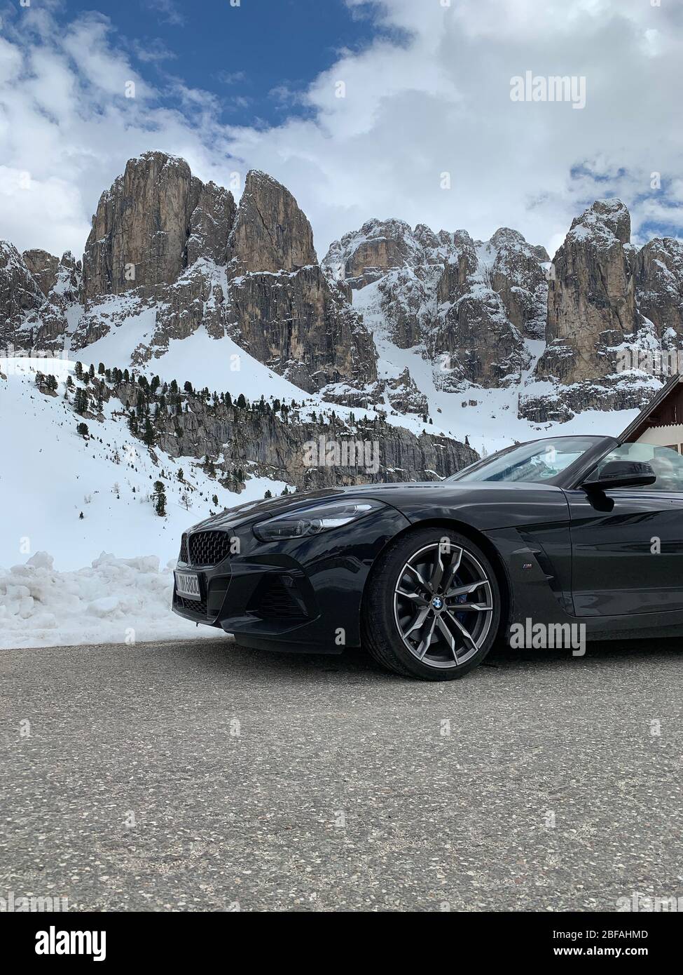 Italy, Dolomites, 10 May 2019: The new BMW Z4 M model a cabriolet is parked on one of roads of the Italian Alps, black color, sports version, the Stock Photo