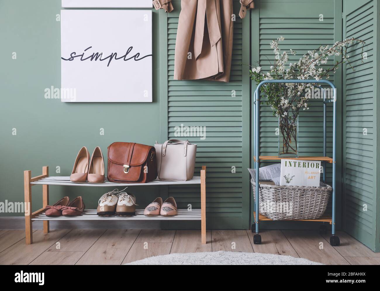 Stylish interior of modern hall with spring flowers Stock Photo - Alamy