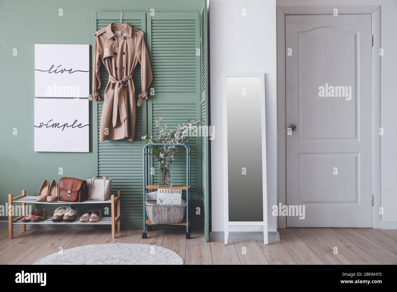 Stylish interior of modern hall with spring flowers Stock Photo - Alamy