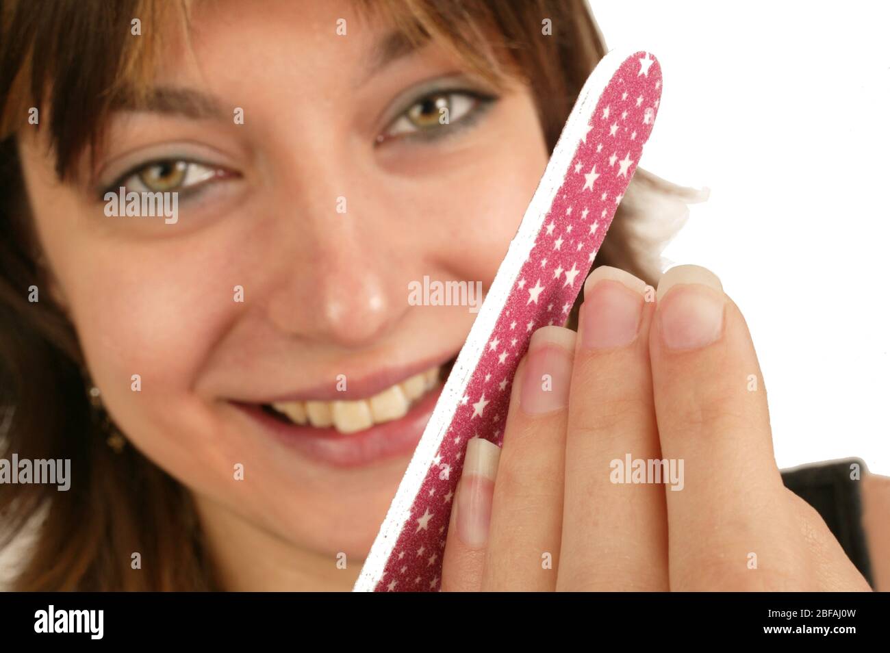 A young woman using an emery board to file her nails. Emery boards are  generally less abrasive than the metal nail files and hence, emery boards  may t Stock Photo - Alamy