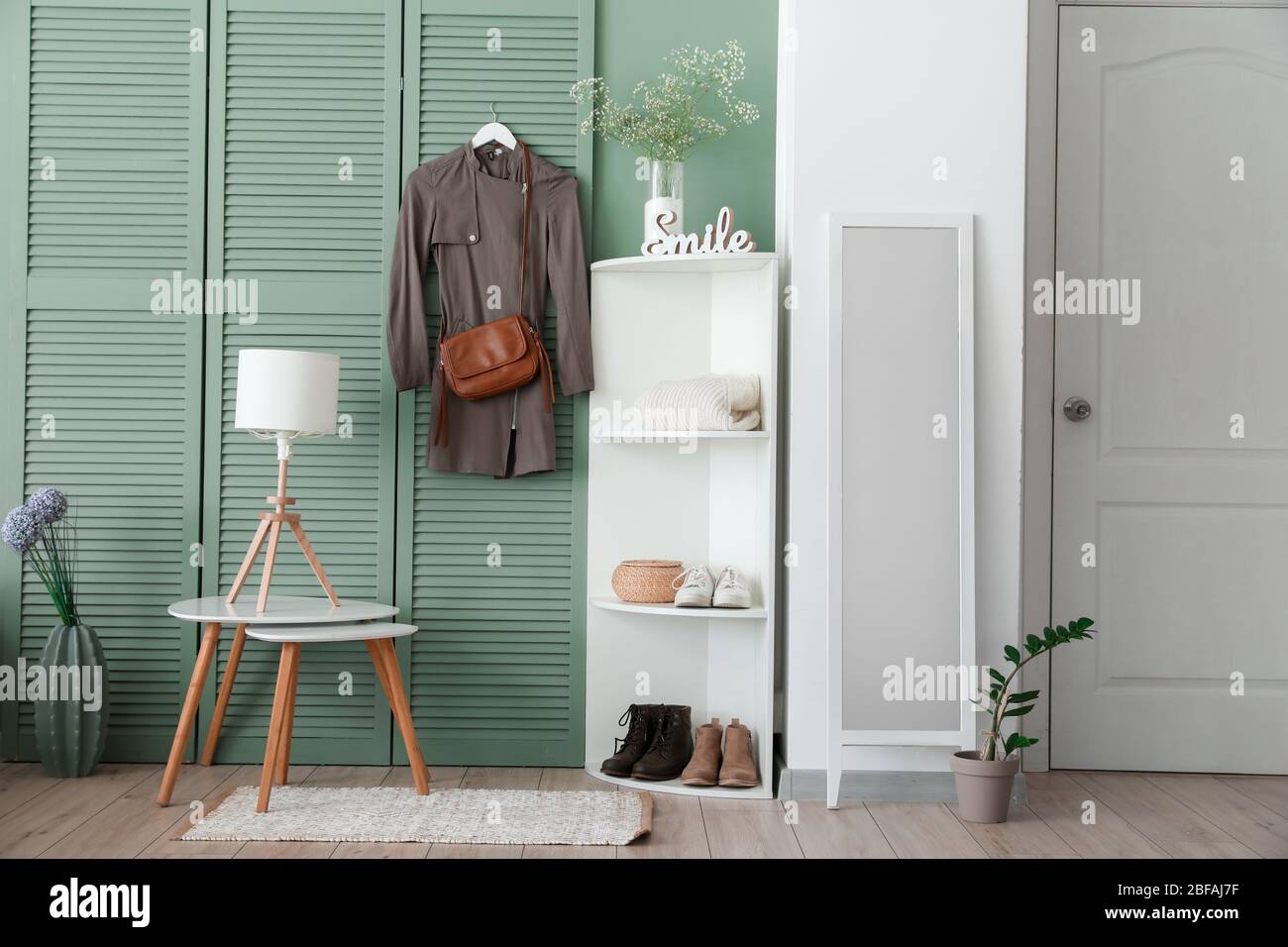 Stylish interior of modern hall with spring flowers Stock Photo - Alamy
