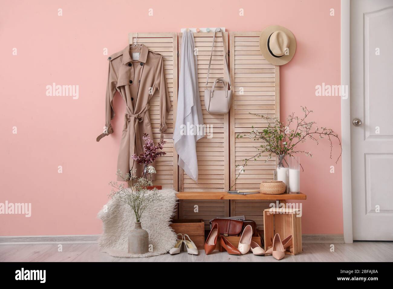 Stylish interior of modern hall with spring flowers Stock Photo - Alamy