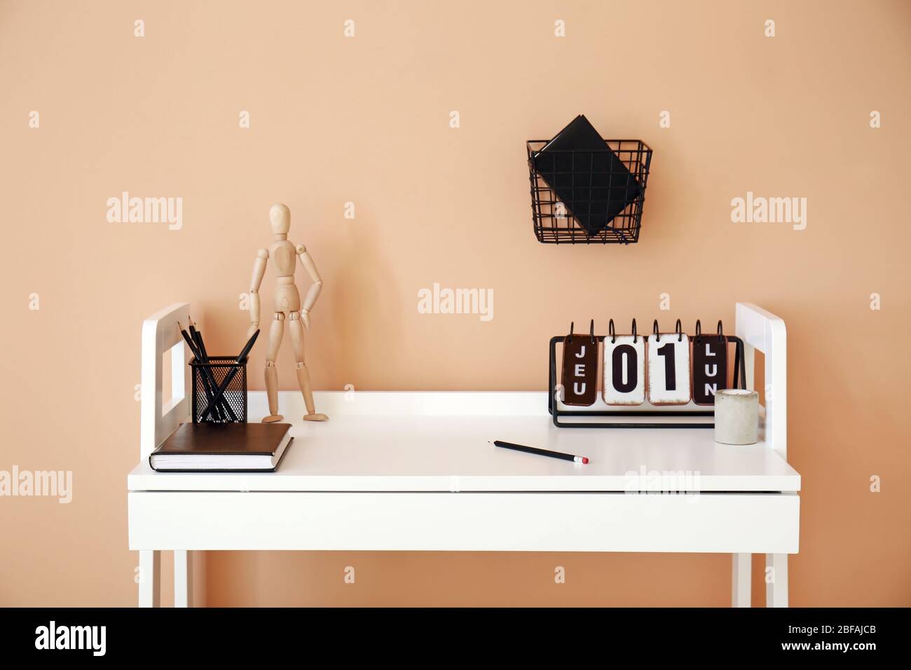 Modern stylish workplace near color wall Stock Photo