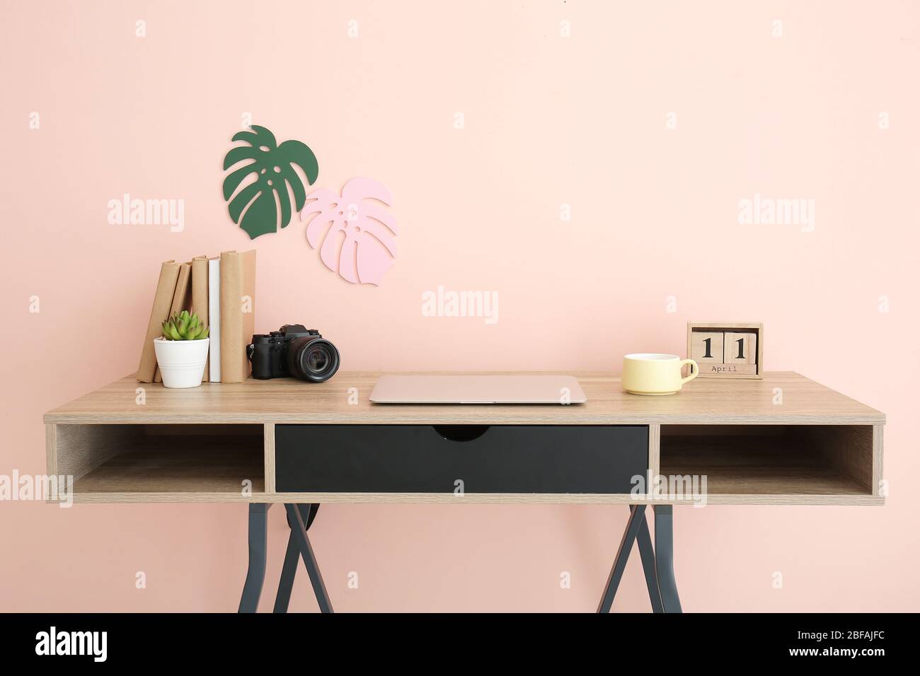 Modern stylish workplace near color wall Stock Photo