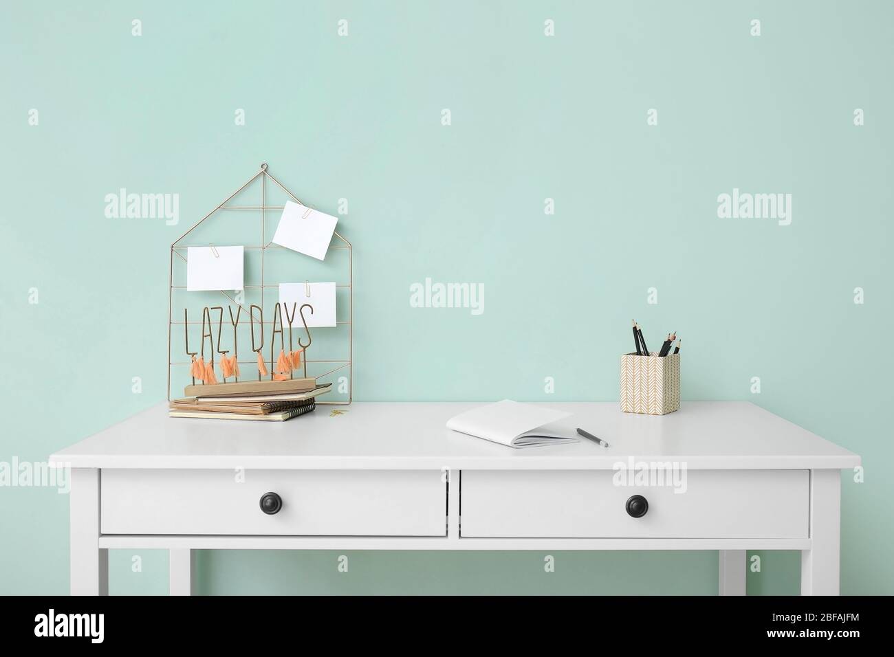 Modern stylish workplace near color wall Stock Photo