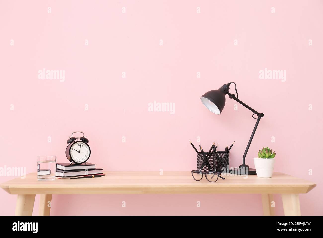 Modern stylish workplace near color wall Stock Photo
