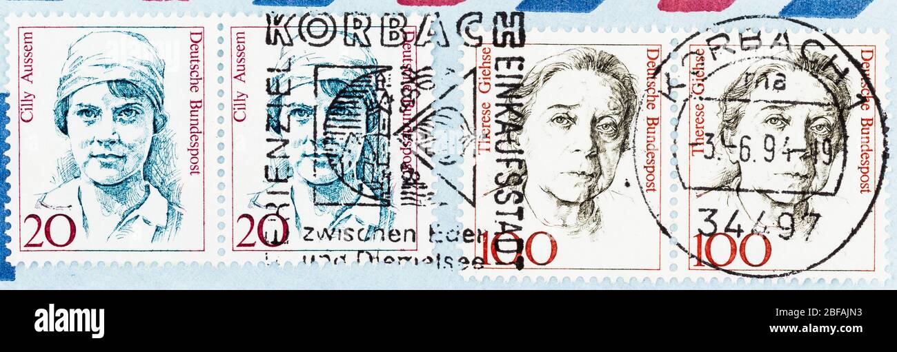 SEATTLE WASHINGTON - April 16, 2020: German stamps from the Famous Women Issue, featuring Cilly Aussem and Therese Giehse on air mail envelope. Stock Photo