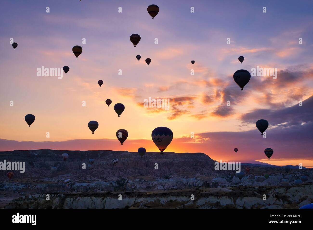 Air balloon flying on sky at Cappadocia, Goreme, Nevsehir, Turkey. Holiday, travel and vacation in Cappadocia Turkey Stock Photo