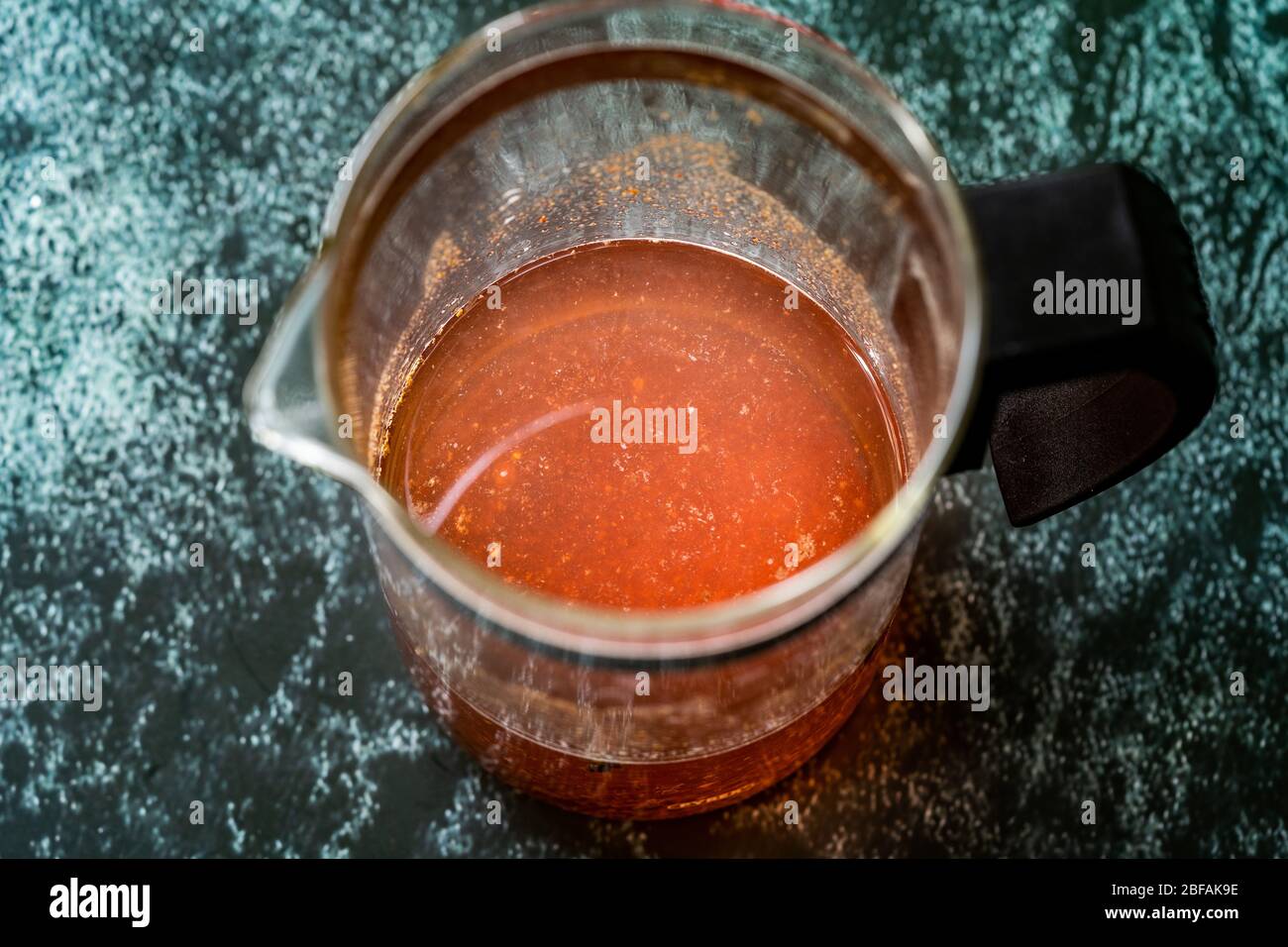 Sumac water or tea and dried ground red Sumac spices with cloves in