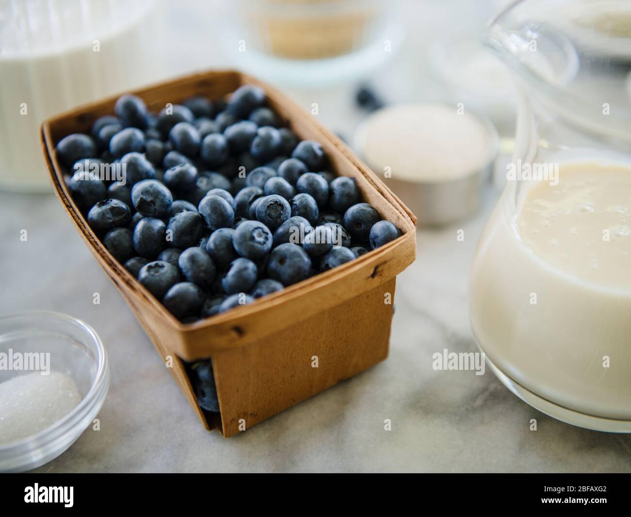 Blueberries in basket and jug of milk Stock Photo Alamy