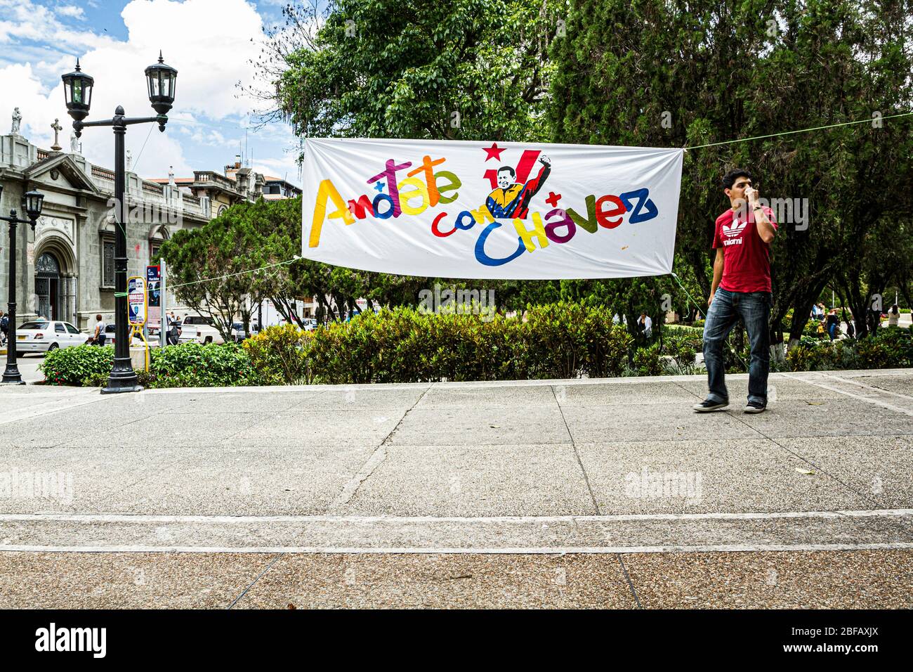 Banner with the figure of Hugo Chavez in Bolivar Square (Plaza Bolivar). Merida, Merida, Venezuela. Stock Photo