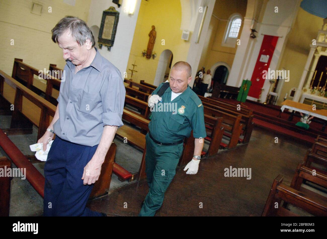 Paramedic accompanying a patient to a chapel in the hospital.(Model released) Stock Photo