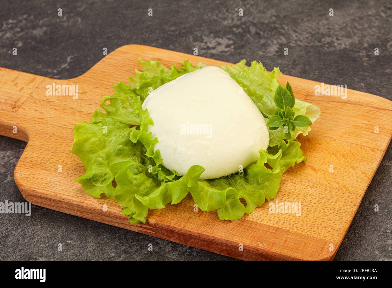 Italian Mozzarella cheese ball over board Stock Photo Alamy