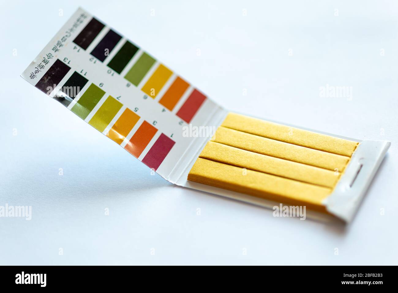 Universal Litmus pH test and color scale on white background Stock Photo
