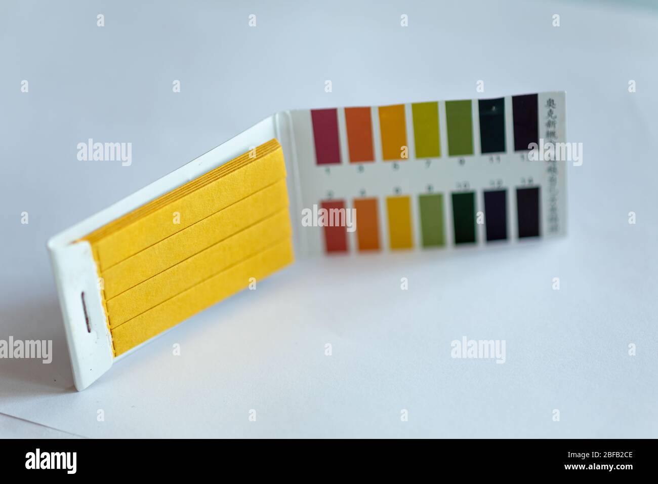 Universal Litmus pH test and color scale on isolated background Stock Photo